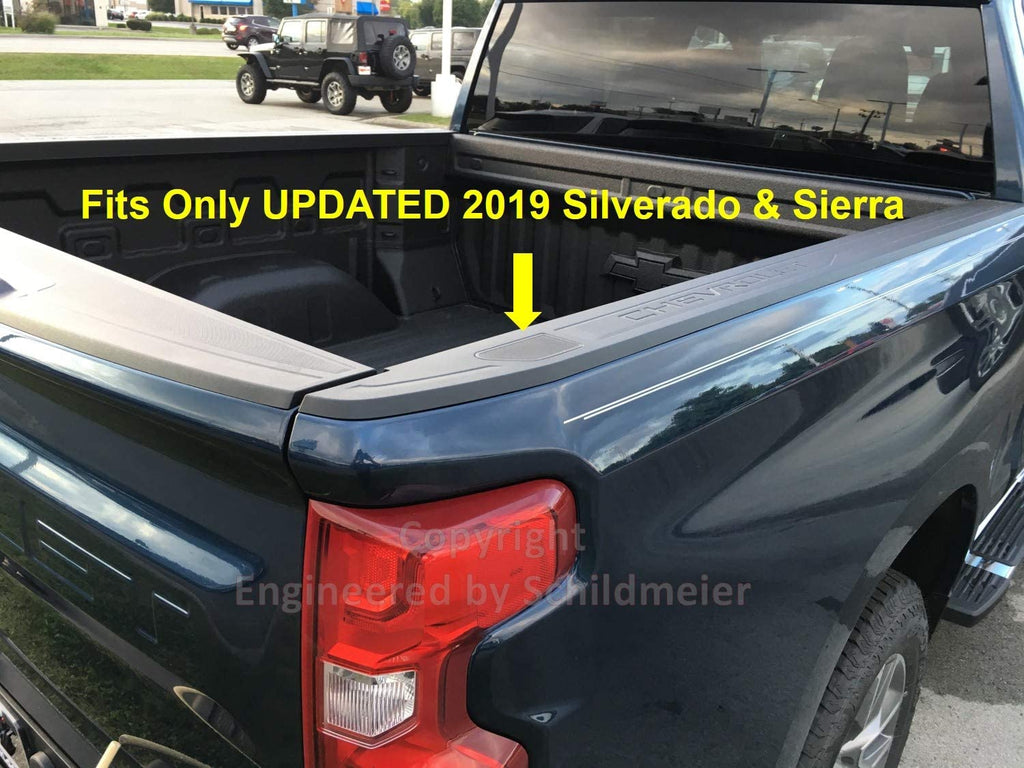 Rear 3/4 image of dark blue Chevrolet Silverado pickup truck with text overlay - Fits Only UPDATED 2019 Silverado & Sierra - yellow arrow points to Railcaps stake pocket cover installed in truck's bedrail. Image is copyright Engineered by Schildmeier.